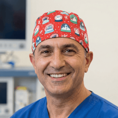 Christmas Snow Globes Red scrub cap shown on model