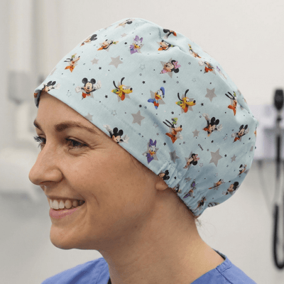 Disney Mickey Mouse + Friends Blue Grey Stars scrub cap shown on model