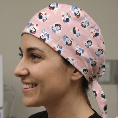 Disney Princess Snow White On Pink scrub cap shown on model