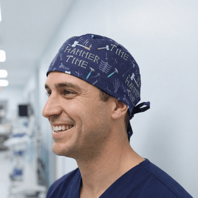 It's Hammer Time Bones scrub cap shown on model