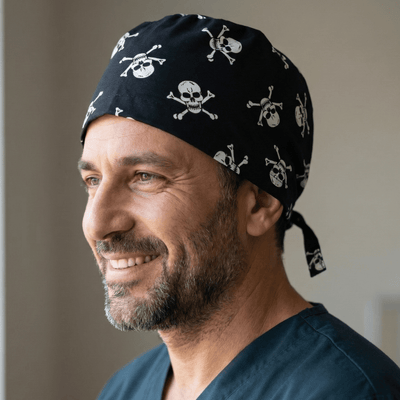Black scrub cap with white skull and crossbones pirate pattern tie-back design