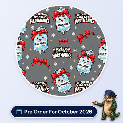 Last Christmas I Gave You My Hartmann's scrub cap print: smiling Hartmann's fluid bags tied with red bows and snowflakes on grey, with a Pre Order For October 2026 badge