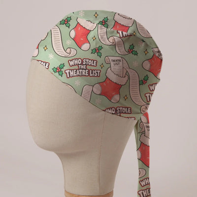 Who Stole The Theatre List scrub cap: Christmas stockings stuffed with long theatre lists and holly on sage green