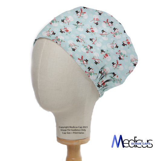 A mannequin head displays the Christmas Snowmen Scrub Cap, featuring festive snowmen on a light blue background. Medicus Scrub Caps branding is in the bottom right corner.