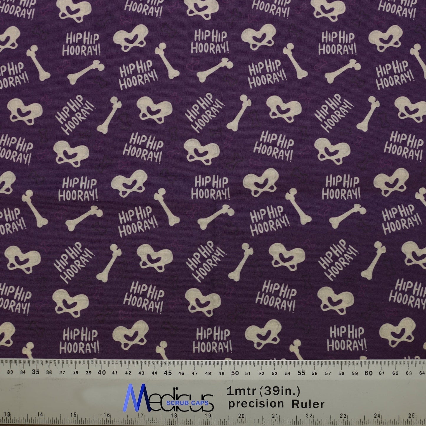 Hip Hip Hooray Scrub Cap from Medicus Scrub Caps featuring a purple background with bone and pelvis illustrations.