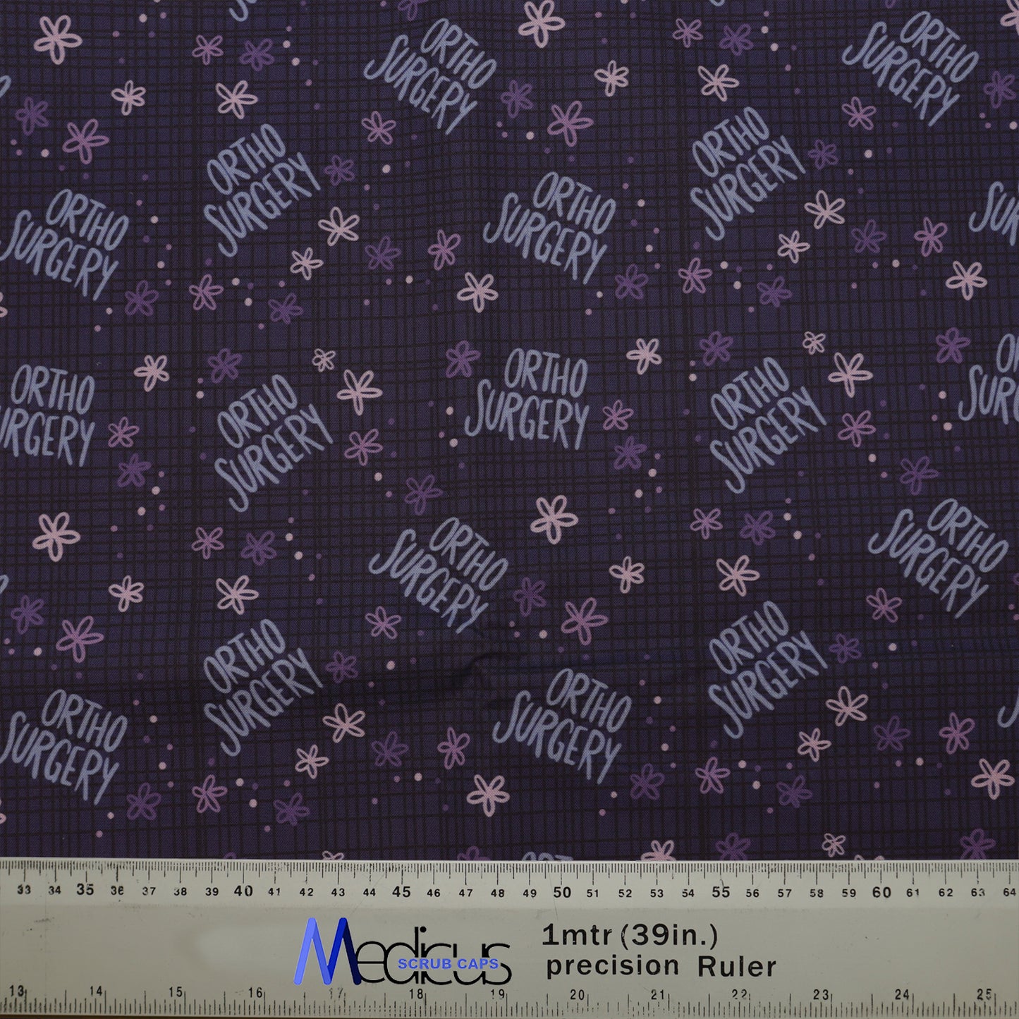 Ortho Surgery Scrub Cap from Medicus Scrub Caps, featuring a dark background with purple text and floral patterns.
