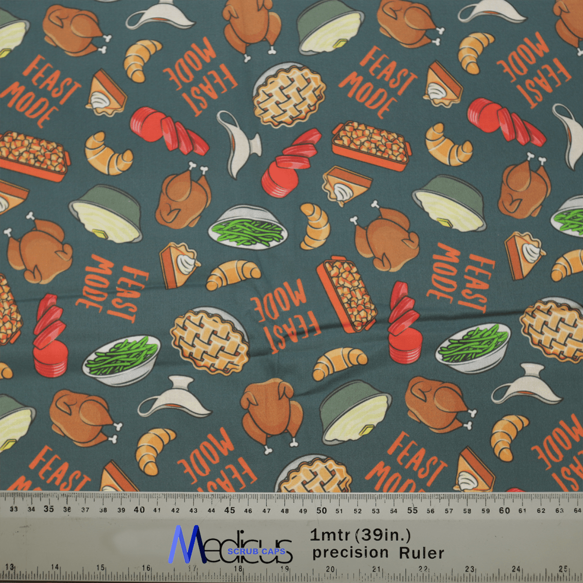 The Medicus Scrub Caps Holidays Thanksgiving Feast Mode scrub cap showcases a Thanksgiving-themed pattern with turkeys, pies, green beans, and dinner rolls alongside FEAST MODE text. A measuring ruler illustrates its eco-friendly design.