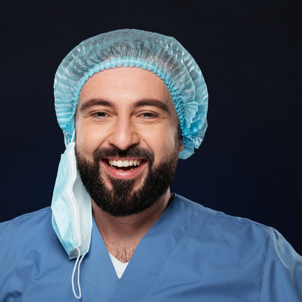 Close-up portrait of a surgeon wearing a scrub cap