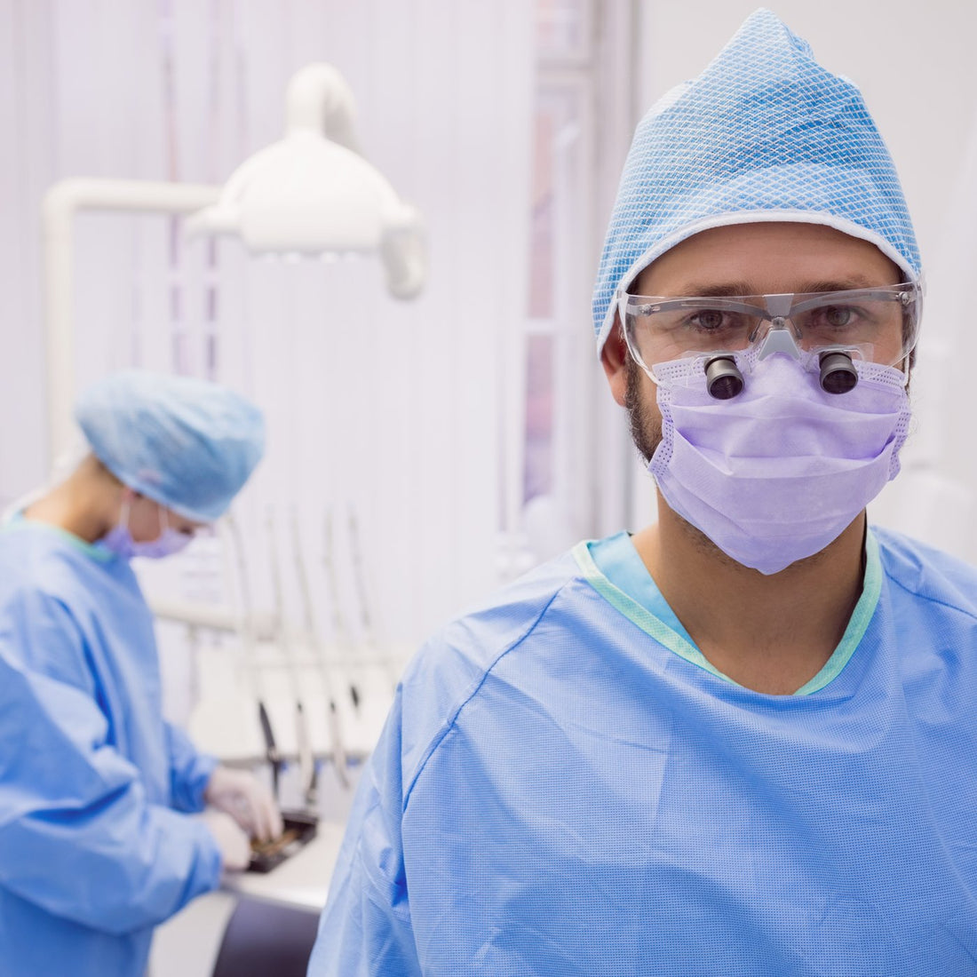 Dental professional wearing a cap in a dental clinic