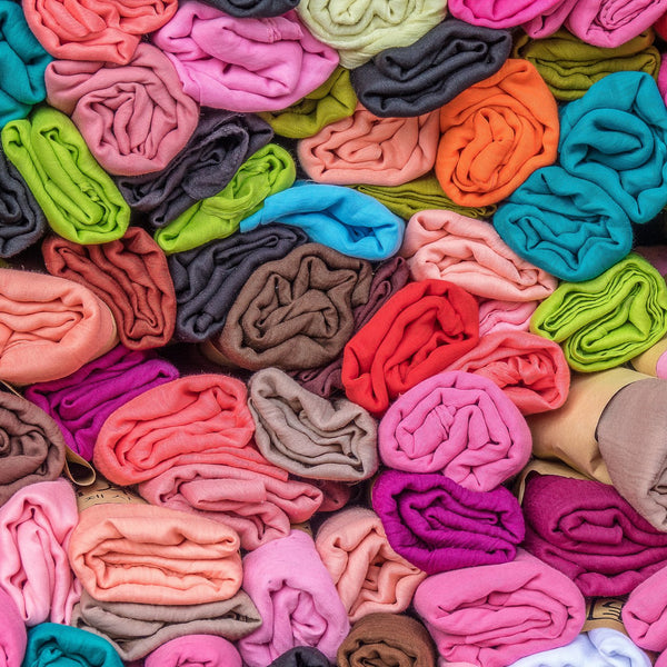 Stack of folded colourful fabric pieces