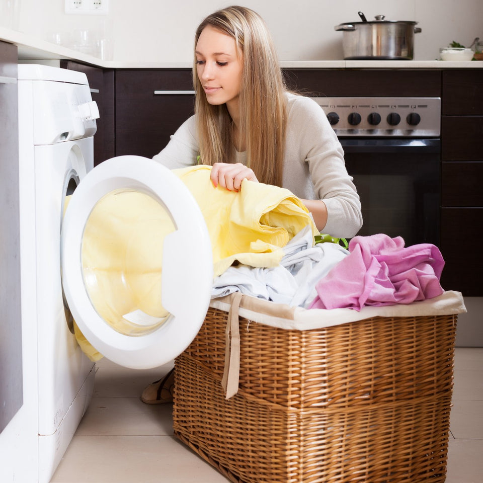 Loading laundry into a home washing machine