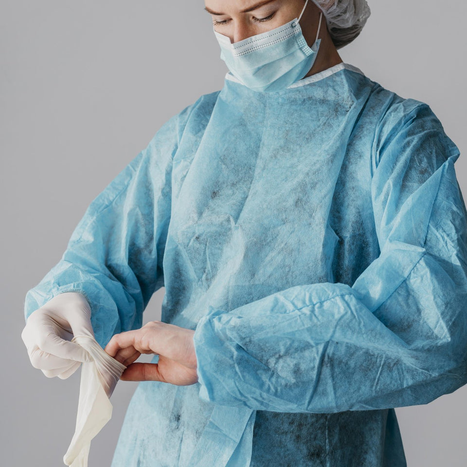 Surgeon putting on surgical gloves before an operation
