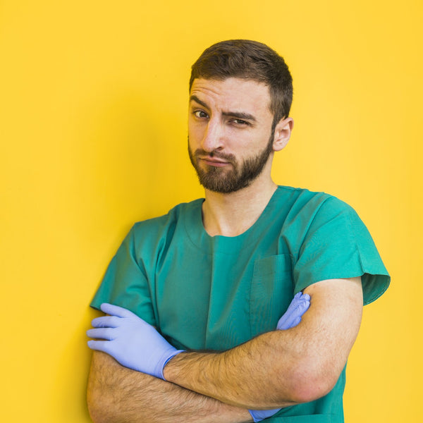 Male doctor with arms crossed