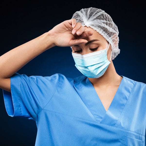 Doctor wearing a surgical mask and cap