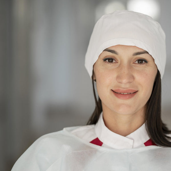 Worker wearing a protective head covering