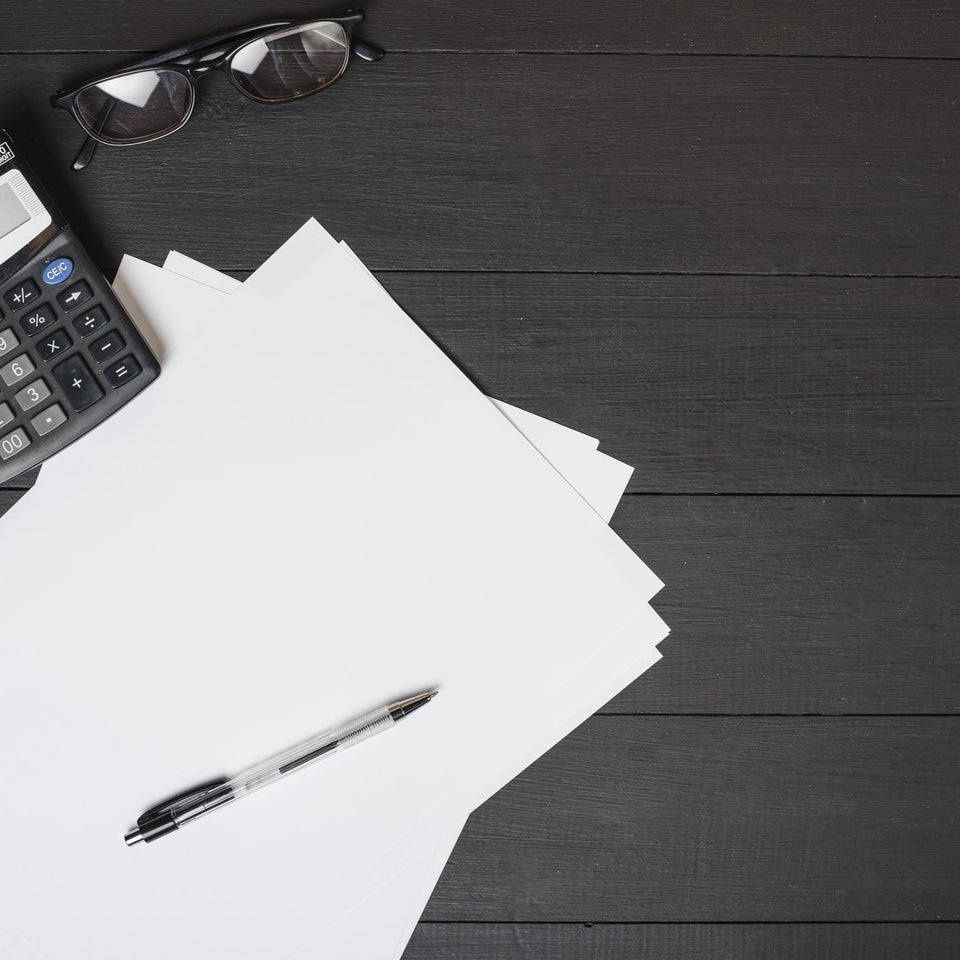 Calculator and paperwork on a desk