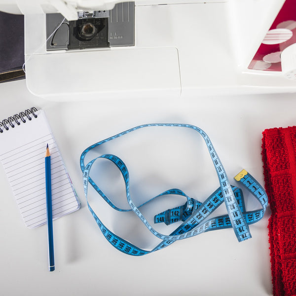 Tape measure and notebook for measuring