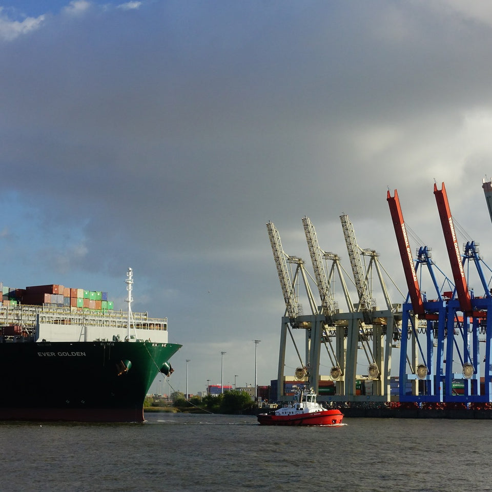 Container ship at a port with cranes