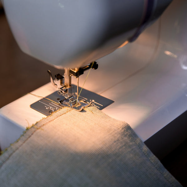 Sewing machine stitching fabric