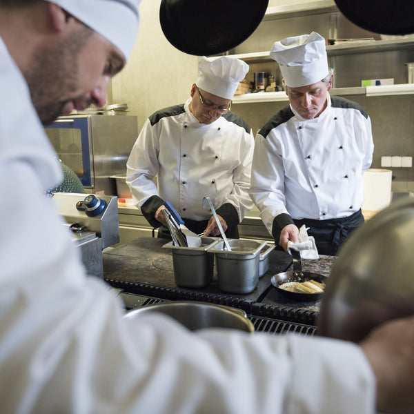 Chefs cooking in a restaurant kitchen