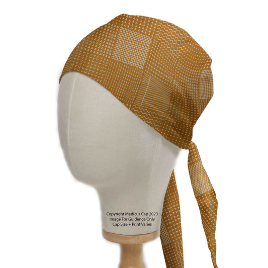 Abstract Lines On Mustard Theatre Scrub Cap from Medicus Scrub Caps, featuring a geometric pattern on mustard fabric, designed for comfort and style in medical settings.