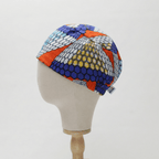 African Honeycomb Scrub Cap (Cobalt, Orange, White, Teal & Gold) scrub cap shown from side angle
