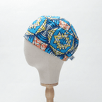 African Blue Starburst (Aqua, Navy, Sunshine Yellow & Coral) scrub cap shown on mannequin head