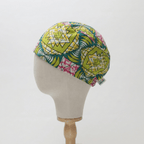 African Geo Starburst (Green, Yellow & Pink) scrub cap shown from side angle