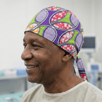 African Green & Purple Disc Scrub Cap (Lime, Violet, Coral & White) scrub cap shown on model
