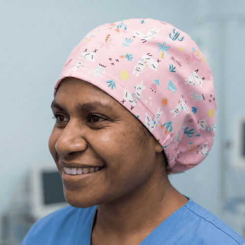 Alpaca / Llama Desert Pink scrub cap shown on model