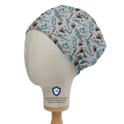 Anaesthetist ABCs Scrub Cap from Medicus Scrub Caps, featuring airway, breathing, coffee-themed illustrations on a grey background.