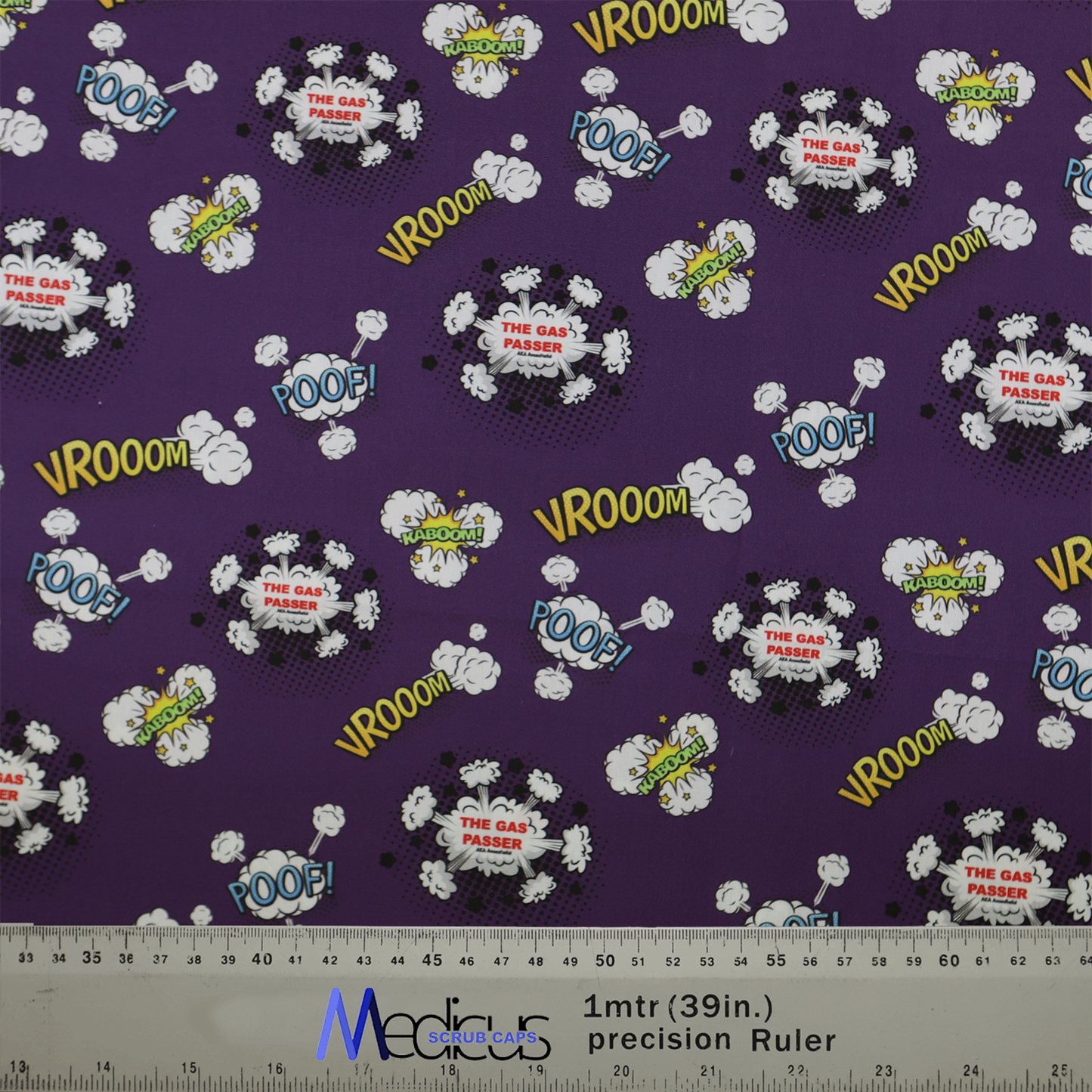 The Medicus Scrub Caps Anaesthetist Gas Passer Scrub Cap features playful purple fabric with comic clouds and words like VROOM, POOF, and KABOOM! Perfect for medical professionals.