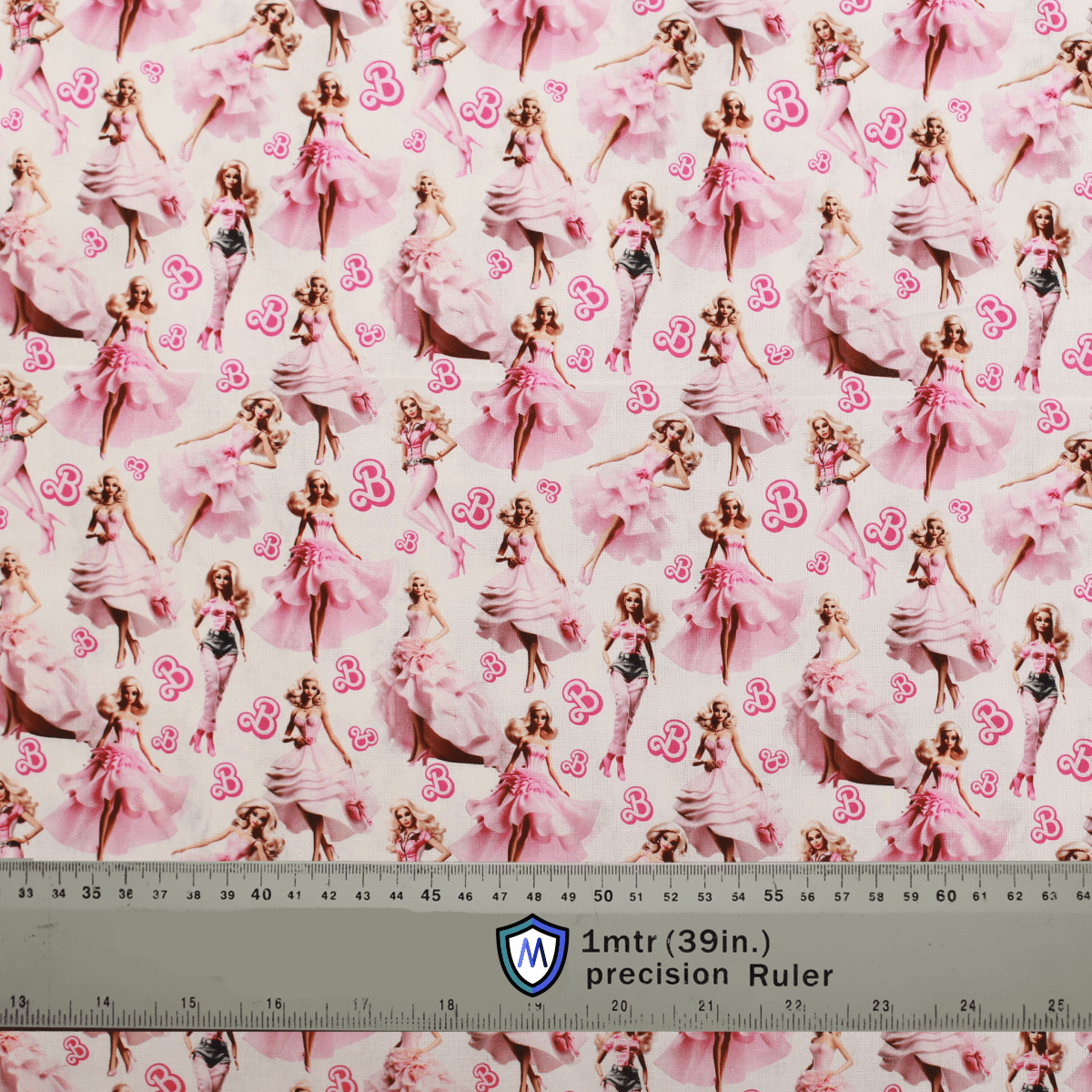 Barbie Ballerina Pink Medicus Scrub Cap fabric with elegant Barbie dolls in pink dresses and ballet poses on a light pink background.
