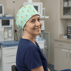 Bees On Teal scrub cap shown on model