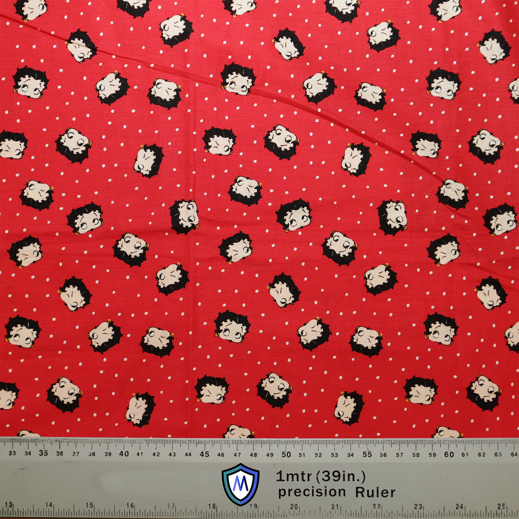 The Betty Boop On Red Scrub Cap by Medicus Scrub Caps features Betty Boop faces on red fabric with white polka dots. A 1-meter ruler shows scale.