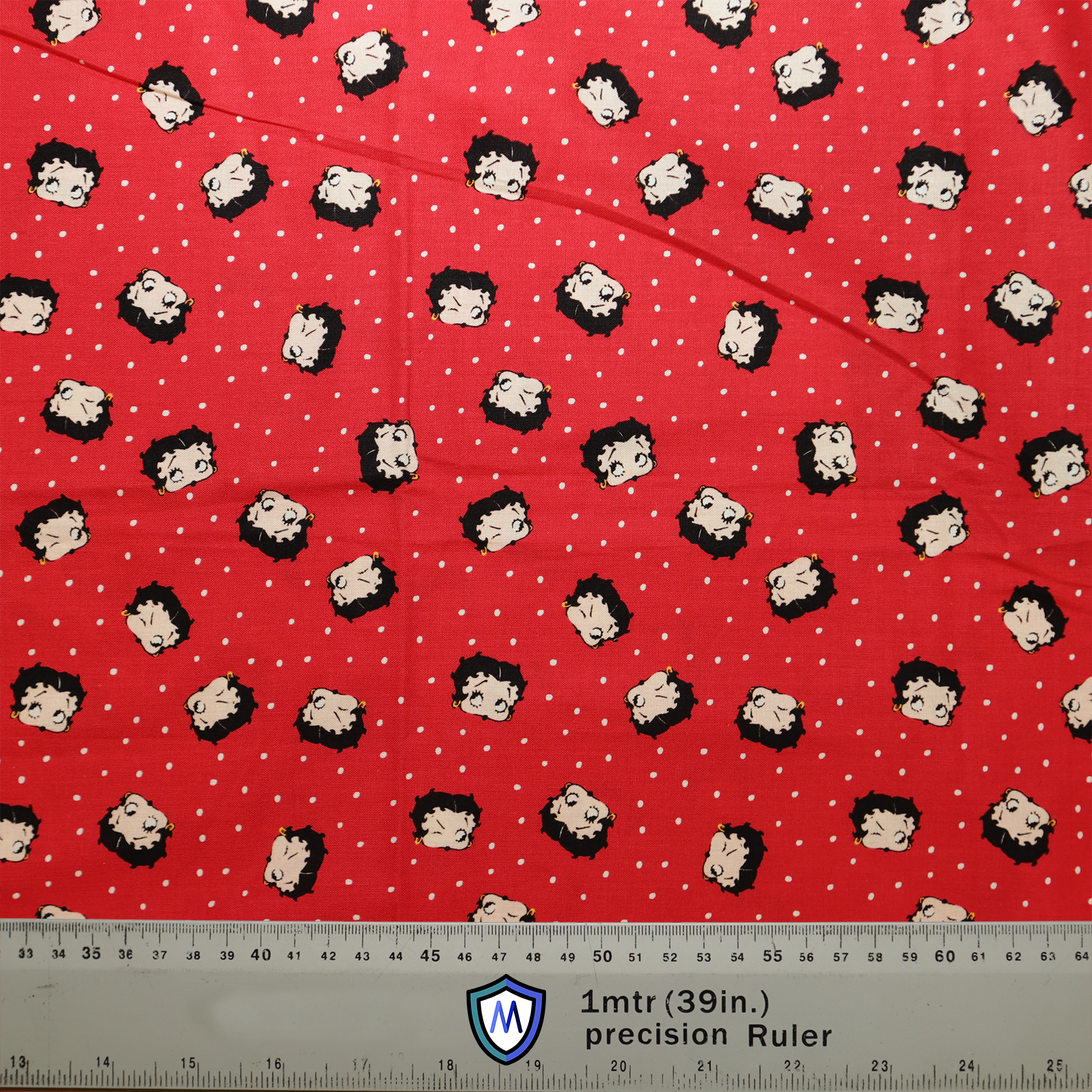 The Betty Boop On Red Scrub Cap by Medicus Scrub Caps features Betty Boop faces on red fabric with white polka dots. A 1-meter ruler shows scale.