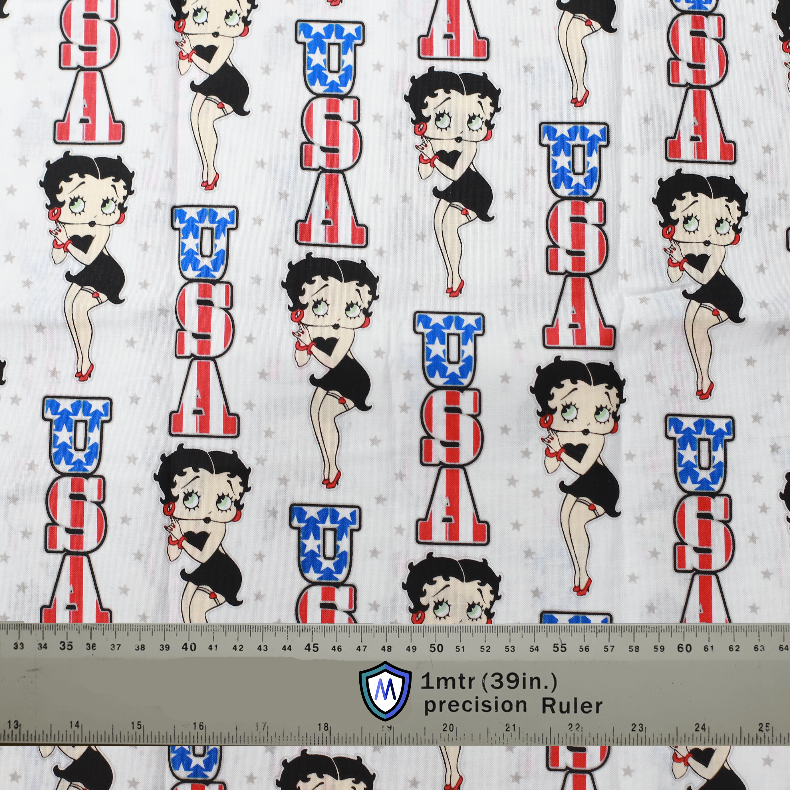 Fabric sample with Betty Boop in patriotic USA-themed design on white background. 1-meter ruler for scale. Ideal for Medicus Scrub Caps.