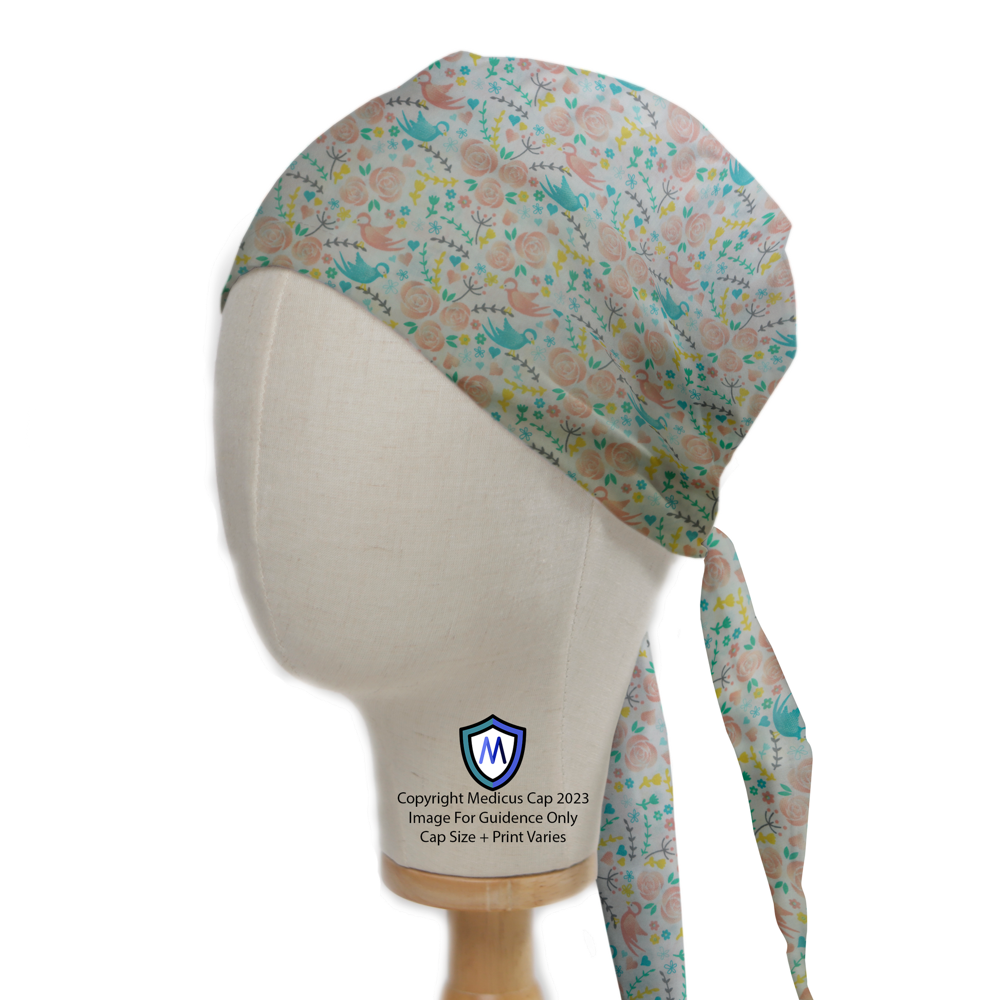 Birds Floral Blue And Pink Scrub Cap from Medicus Scrub Caps, featuring a delicate pattern of birds and flowers on a soft pastel background.