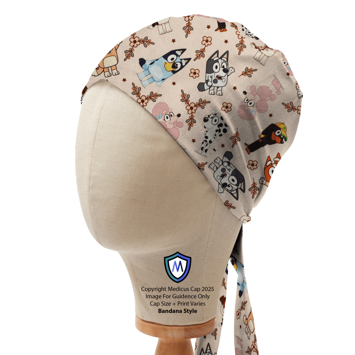 Medicus Scrub Cap featuring Bluey and friends print on a beige background, displayed on a mannequin. Bandana style with tie-back design.
