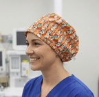 Bluey Bingo On Repeat scrub cap shown on model