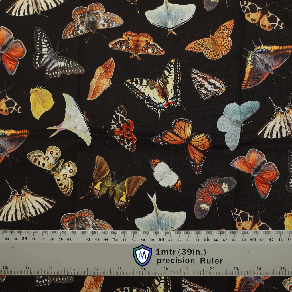 Fabric sample for Medicus Scrub Caps featuring colorful butterflies and moths on a black background. 1-meter ruler for scale. @butterflies-scrub-cap
