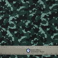 Dark green camouflage fabric with a ruler for scale, ideal for Medicus Scrub Caps, offering a stylish and professional look for medical professionals.