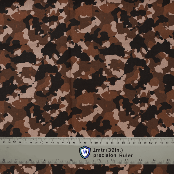 Brown camouflage fabric used for Medicus Scrub Caps, with a precision ruler for scale. Ideal for medical professionals seeking a tactical-inspired design.