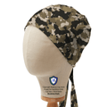 Camouflage Medicus Scrub Cap in bandana style displayed on a mannequin head, featuring adjustable ties for a secure fit.