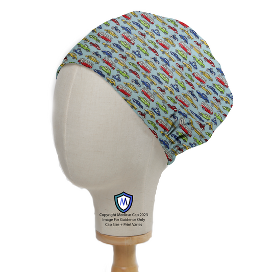 A side view of a mannequin head wearing the Medicus Scrub Caps Cartoon Cars Bikes Traffic Scrub Cap, featuring colorful vehicles on light blue fabric.