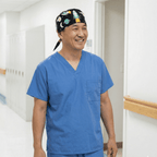 Cartoon Spaceships Blue scrub cap shown on model