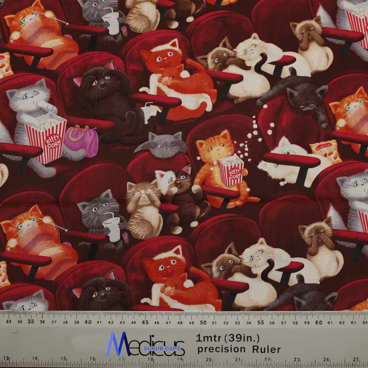 Fabric pattern with cats at the cinema on a dark red background by Medicus Caps, designed for the "Cats at the Cinema" scrub cap.