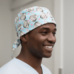 Cats and Pink Stars scrub cap shown on model