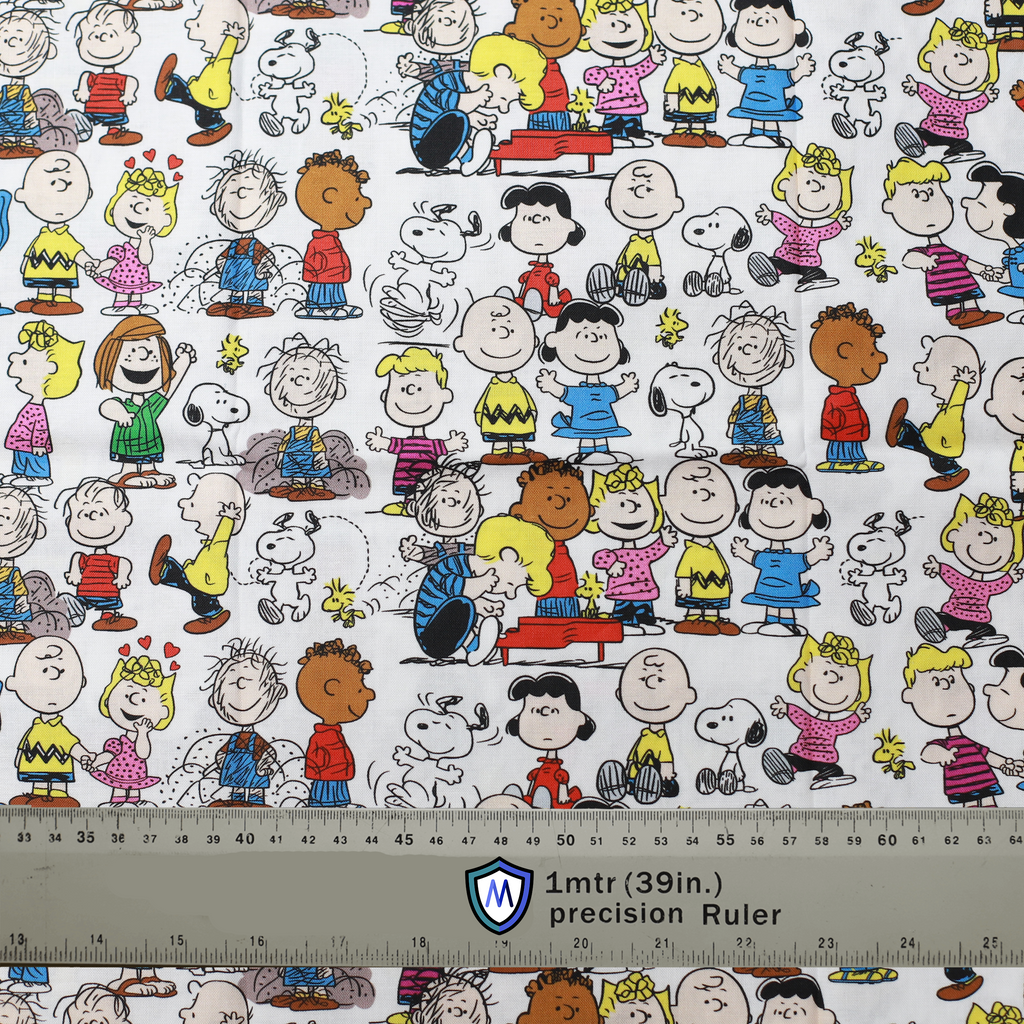 Fabric sample featuring Peanuts characters on a white background, ideal for a Medicus Scrub Cap. 1-meter ruler for scale.