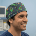 Christmas Cats Ruin Tree scrub cap shown on model